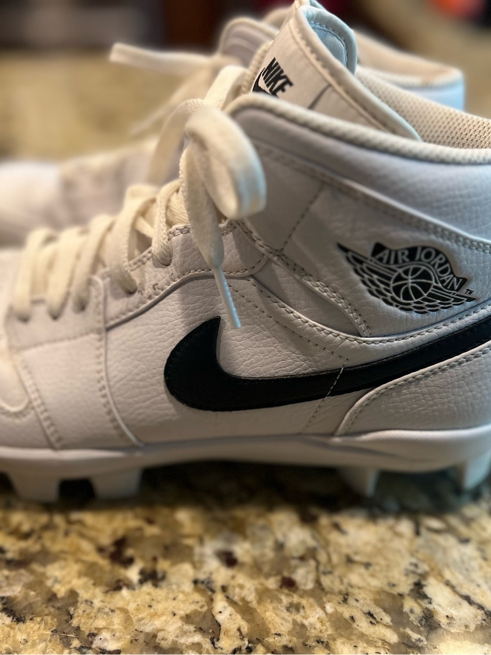 Air Jordan White and Black High-Top Sneaker molded cleats